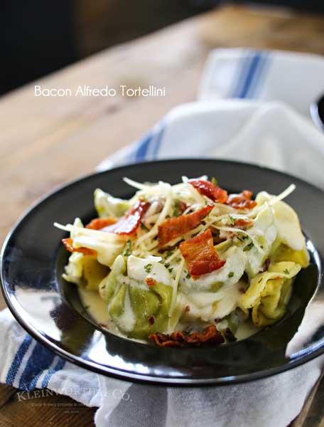 Bacon Alfredo Tortellini is an easy family dinner idea for bacon lovers everywhere. Homemade alfredo sauce, cheesy spinach tortellini & crispy bacon is good