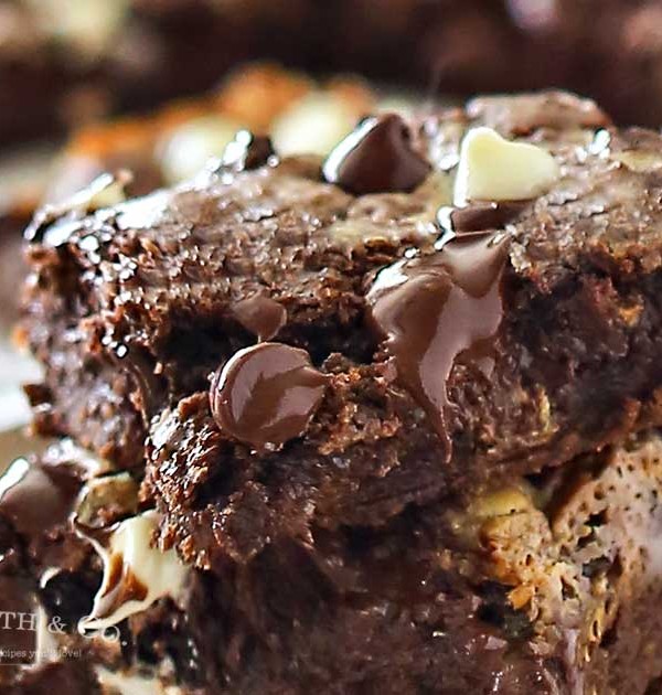 Chocolate Cake Mix Bars are a yummy bar recipe that's simple & easy to make. Using cake mix, a handful of everyday ingredients & loads of chocolate chips, this chocolate dessert is utterly amazing!