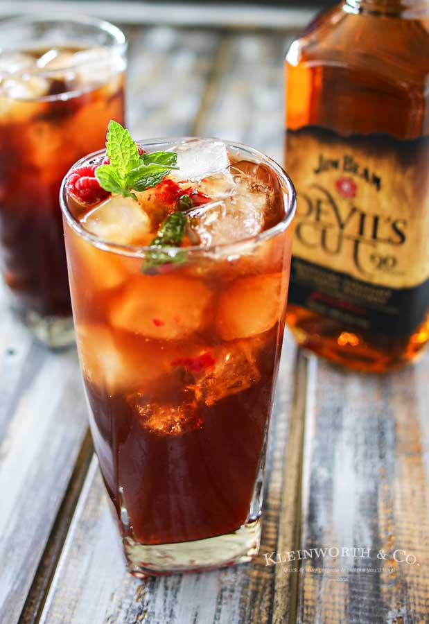 Raspberry Mint HARD Iced Tea is a refreshing summer drink recipe, perfect for a hot day. Fresh raspberries, mint & a little lemon makes this tea perfect.