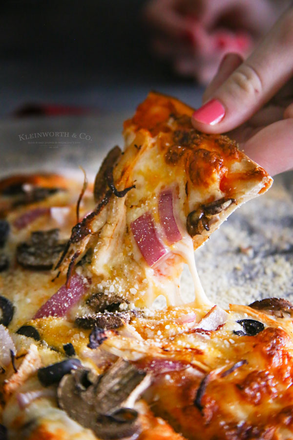 How to make Homemade Pizza Crust: This Onion and Mushroom Thin Crust Pizza is simple and easy to make. The perfect homemade pizza for the whole family.