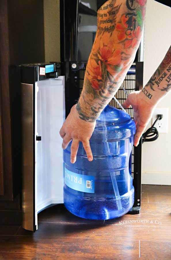 Loading the water dispenser - How to Stay Hydrated