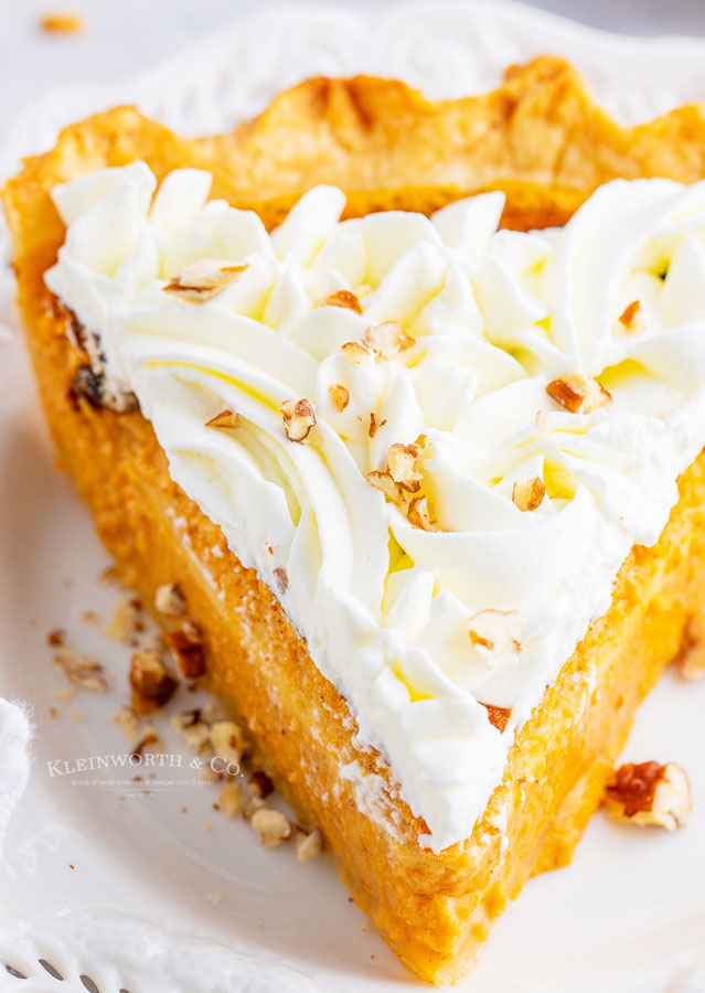 pumpkin pie with decorated whipped cream