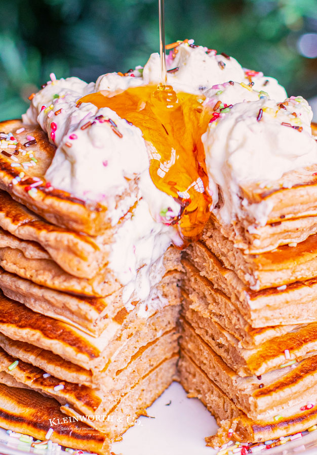 Pouring syrup on Gingerbread Pancakes