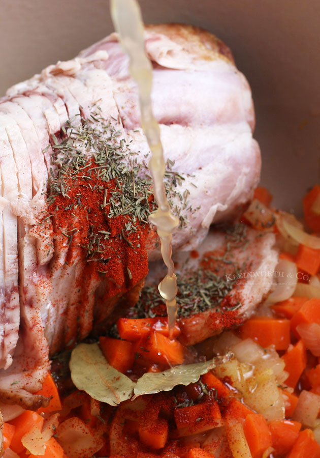 adding broth to Ham and Bean Soup