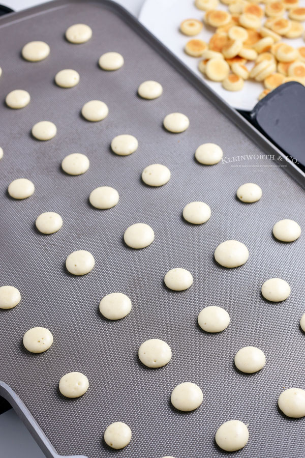 mini pancake cereal on griddle