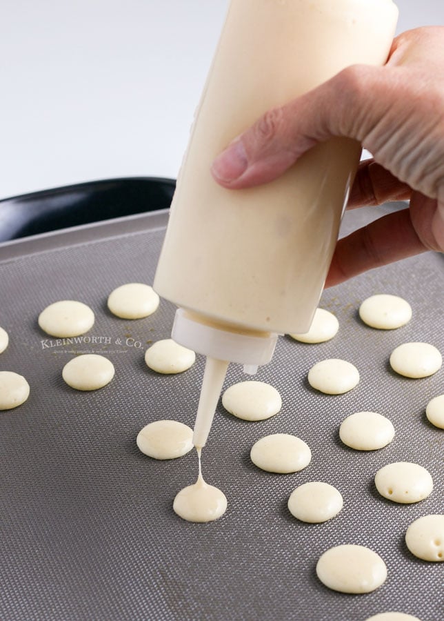 squeezing the batter for pancake cereal