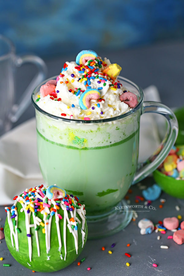 St. Patrick's Day Hot Cocoa Bombs with rainbow marshmallows