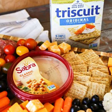 Triscuit and Sabra on snack board