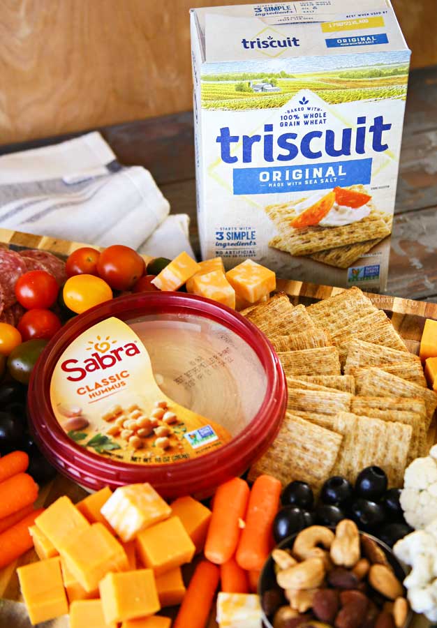 Triscuit and Sabra on snack board