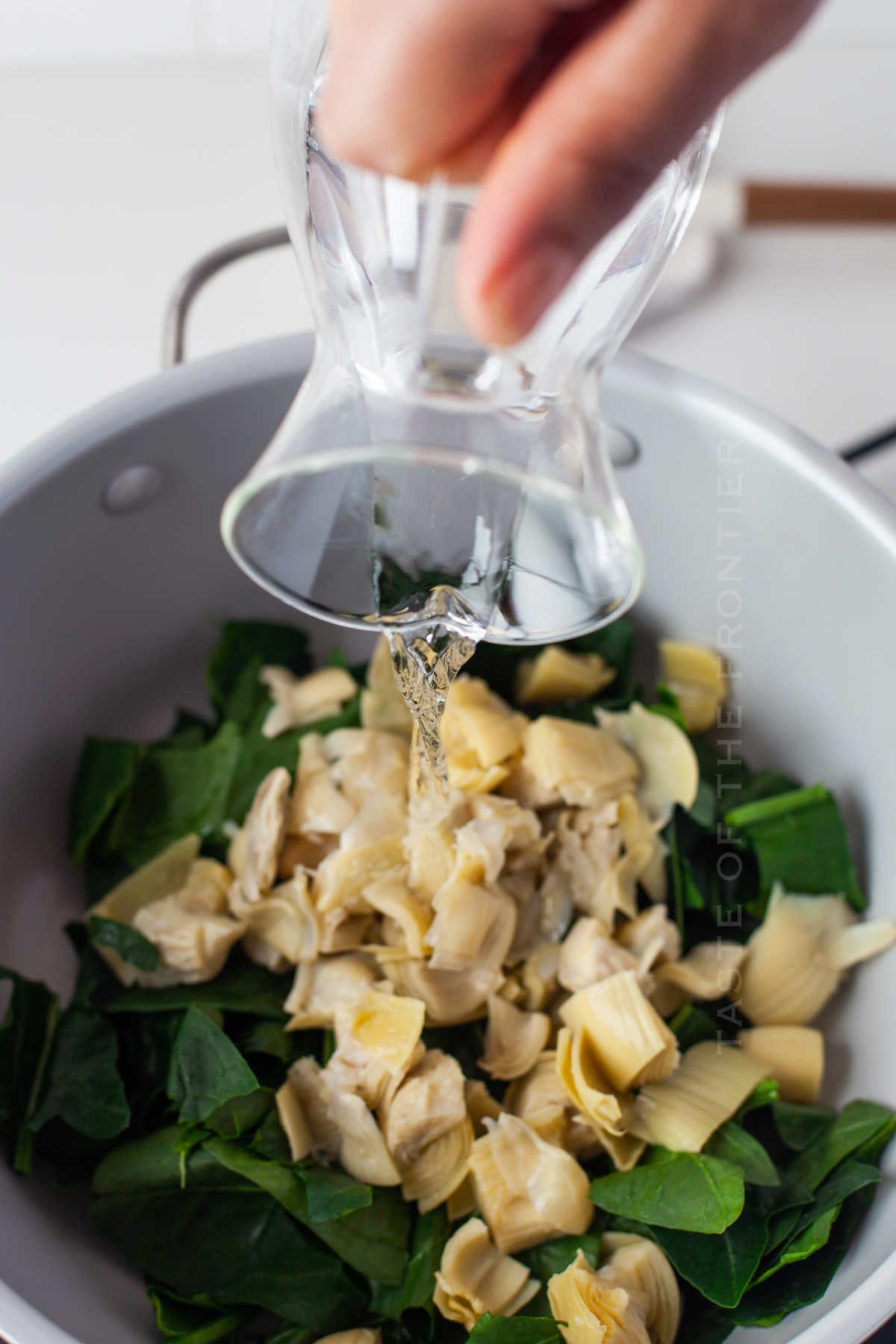 add the water - artichoke mixture