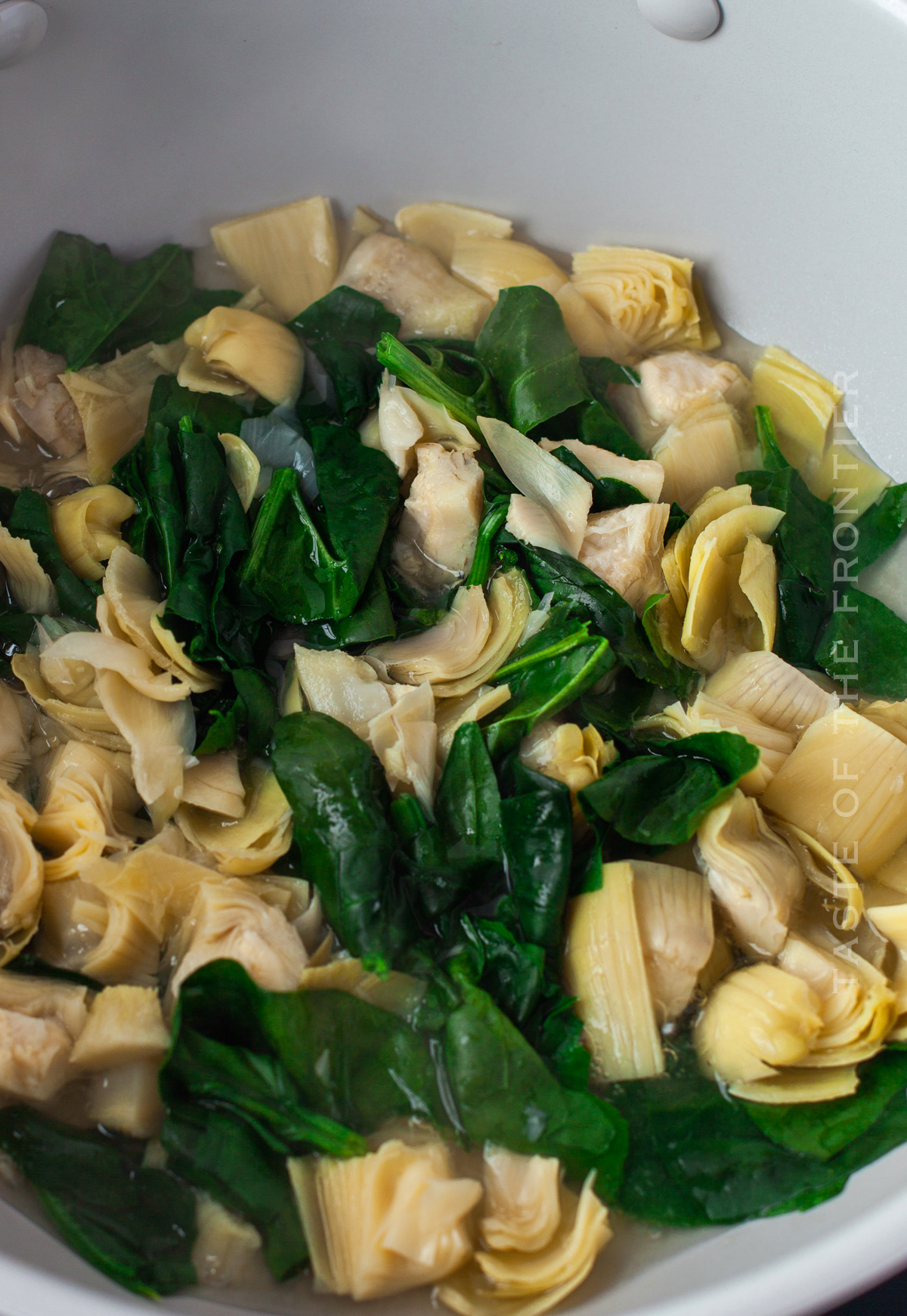 boil the spinach and artichokes