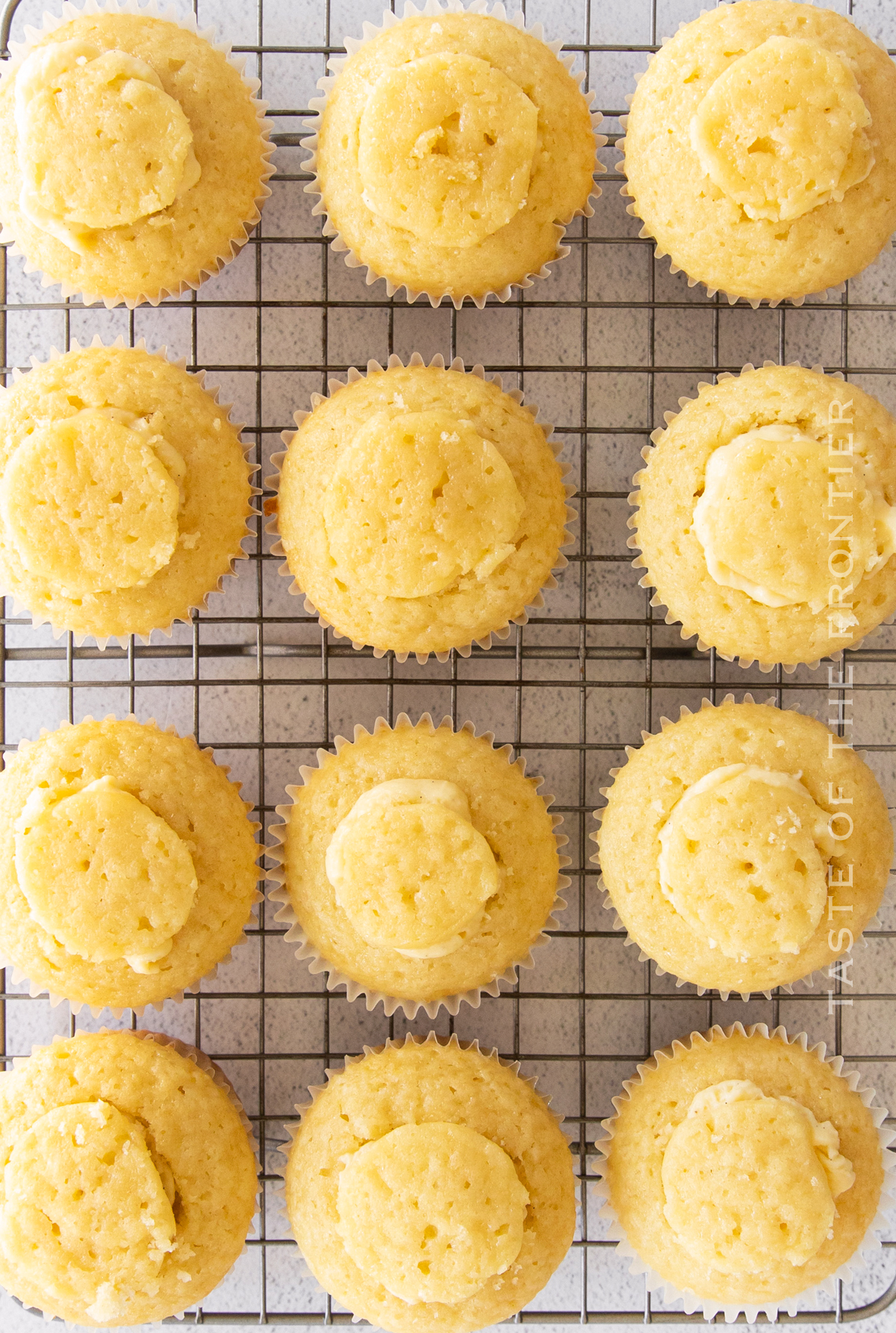 filling cupcakes with creamy filling