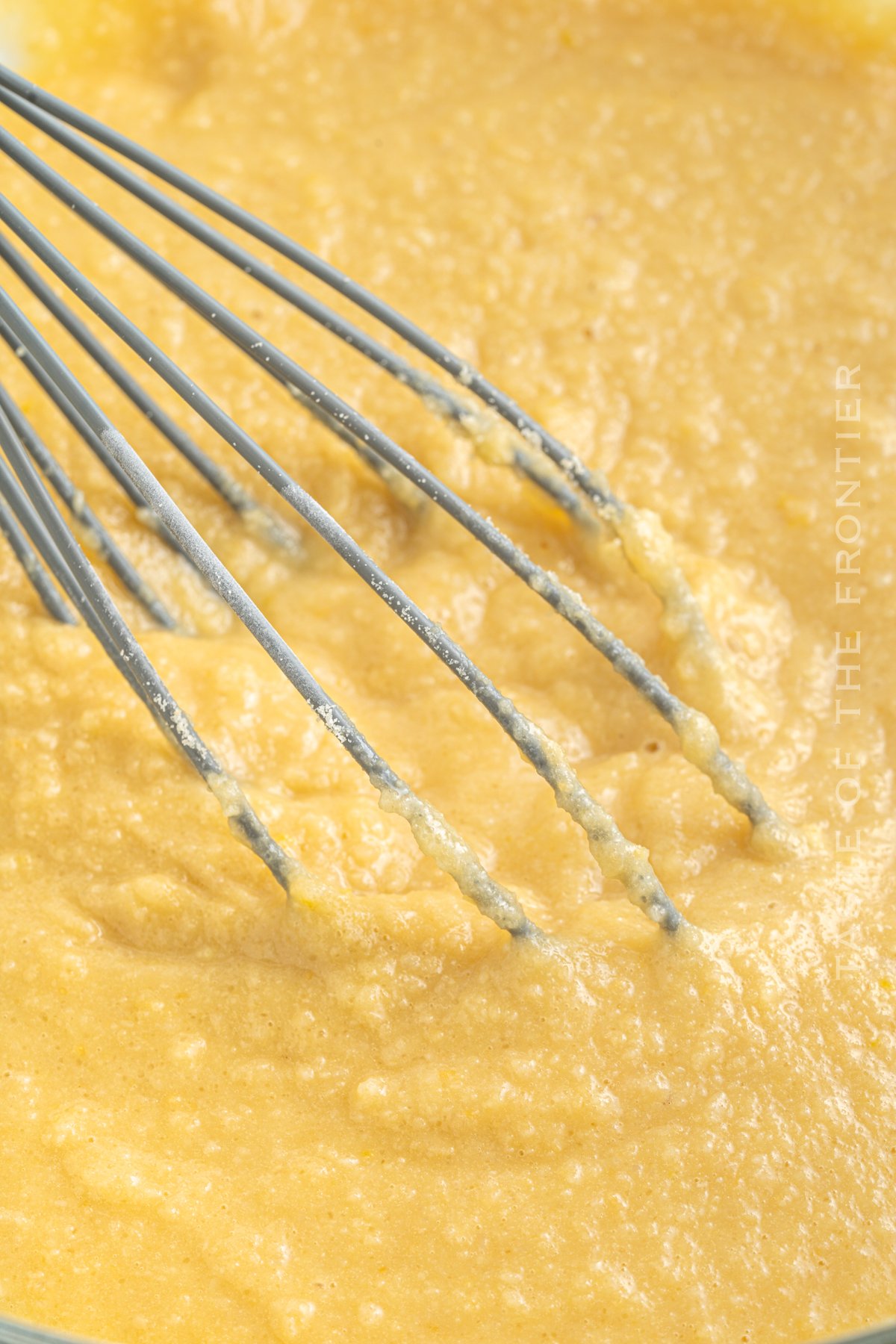 whisking the batter for lemon muffins