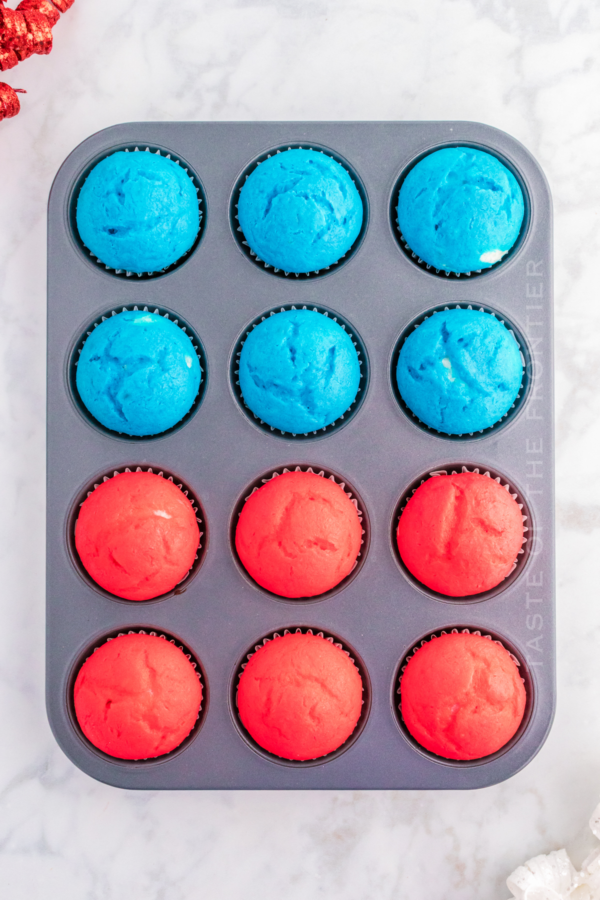 backed red and blue cupcakes