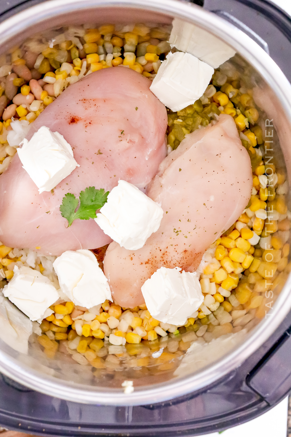 adding chicken and cream cheese chili