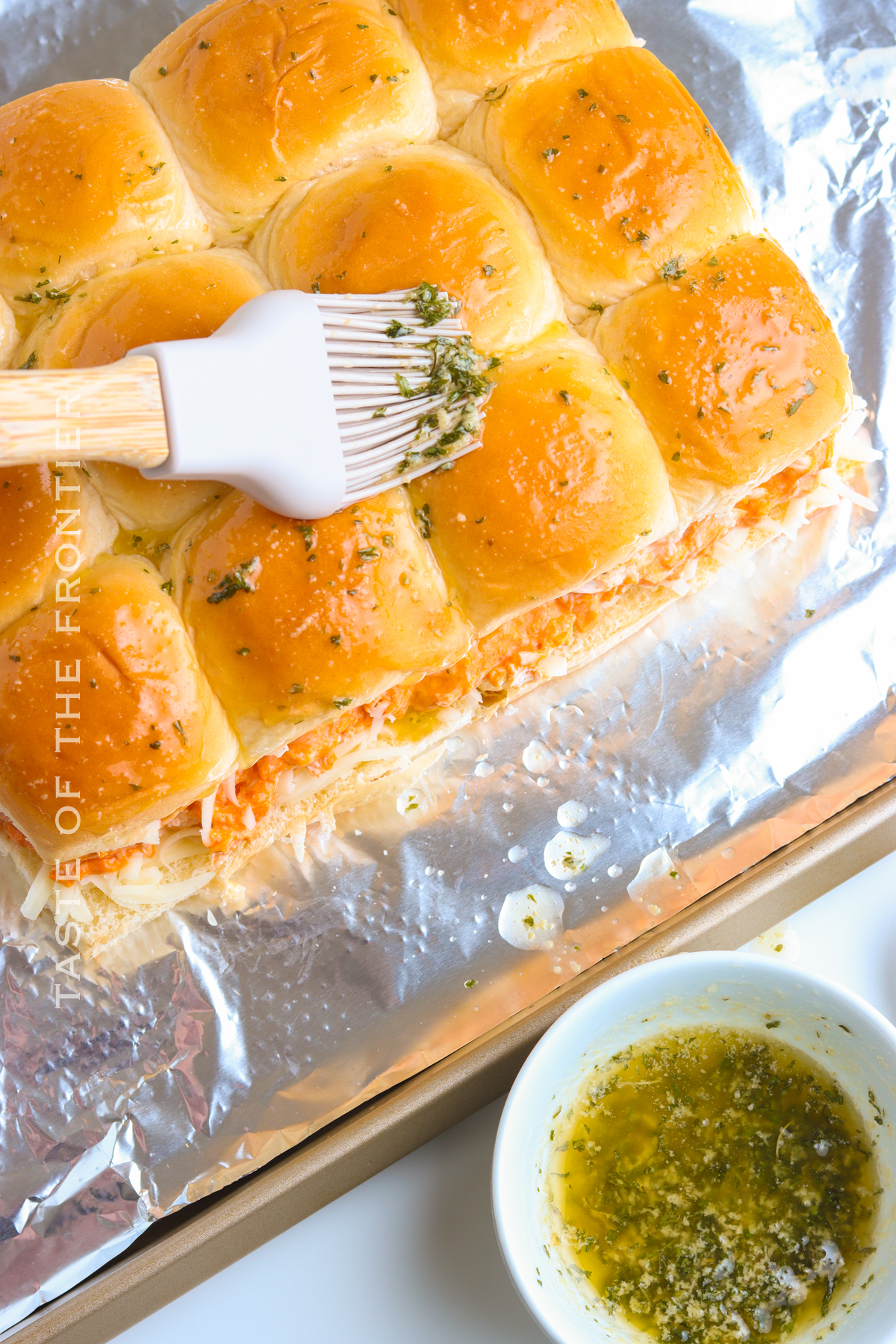 adding butter and herb topping