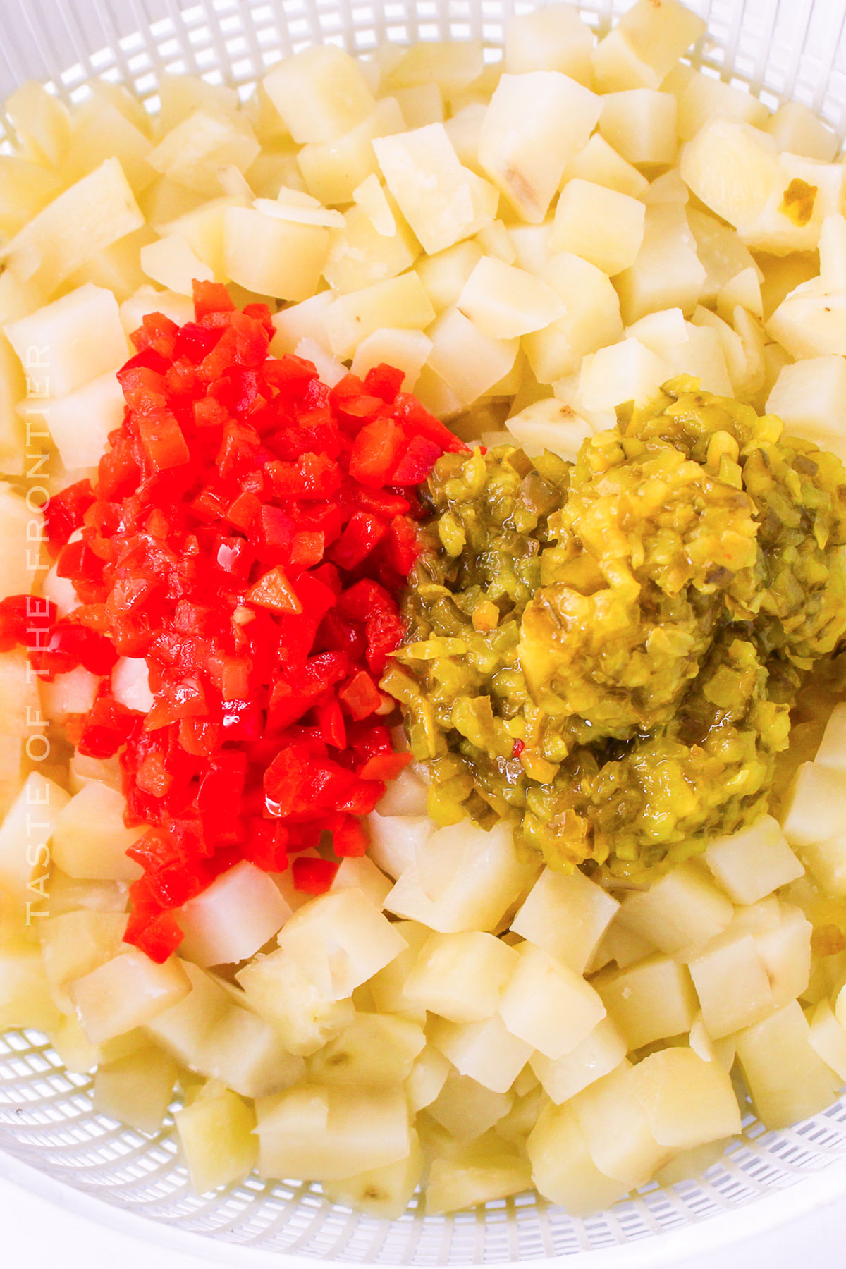 mixing the potato salad ingredients