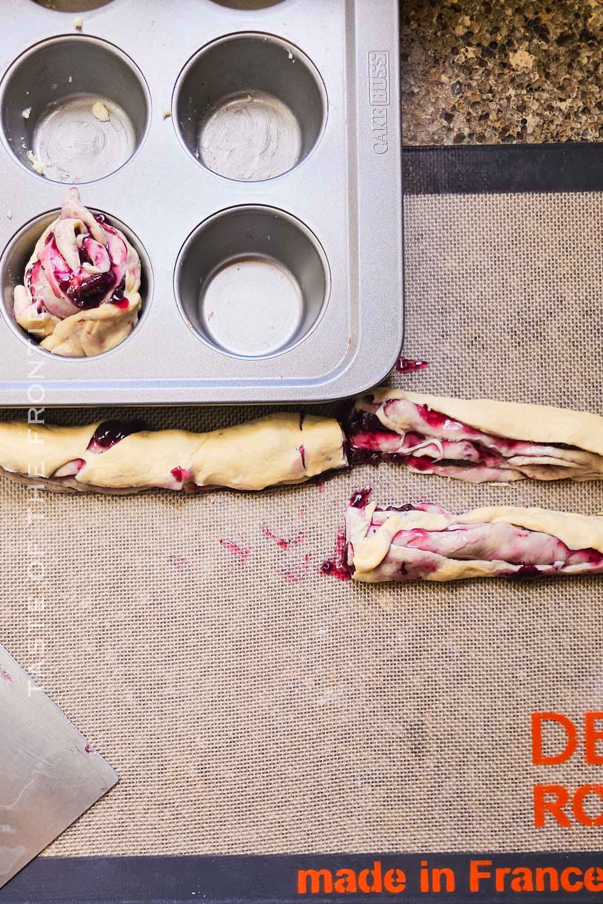 cutting the filled crescent roll dough