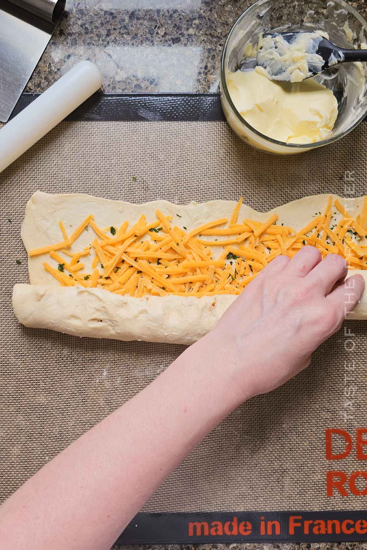 rolling cheesy cruffin dough