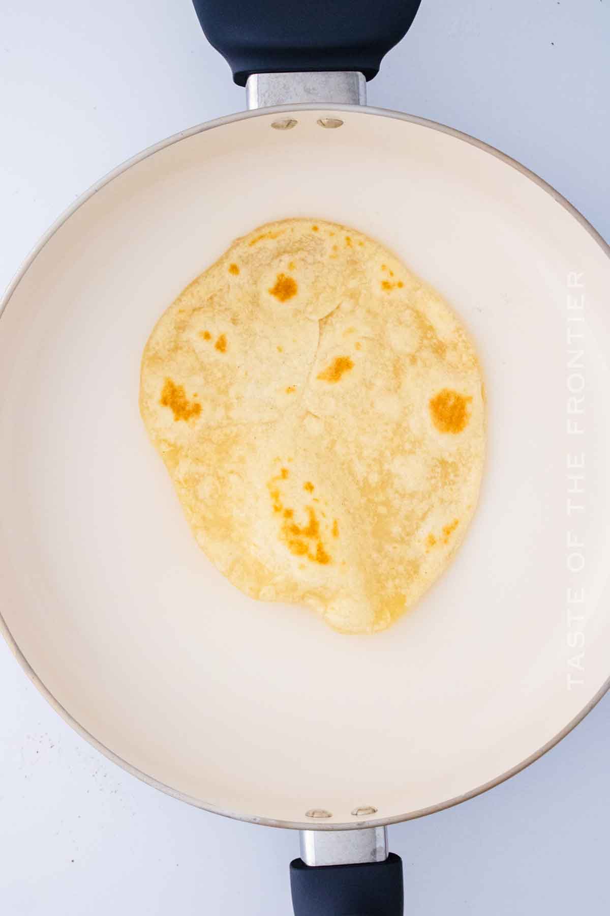 cooking tortillas in a skillet