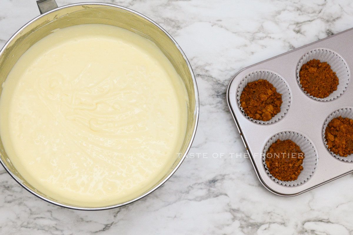 adding the batter on top of the cookie crust