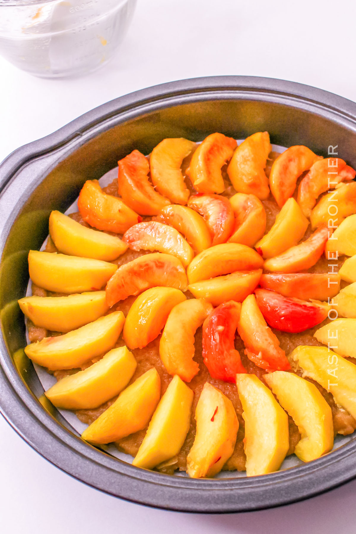 adding the peaches to the brown sugar crumble