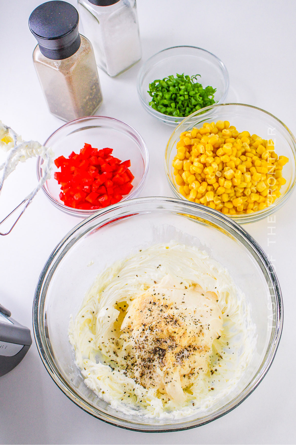 mixing the cheesy dip ingredients