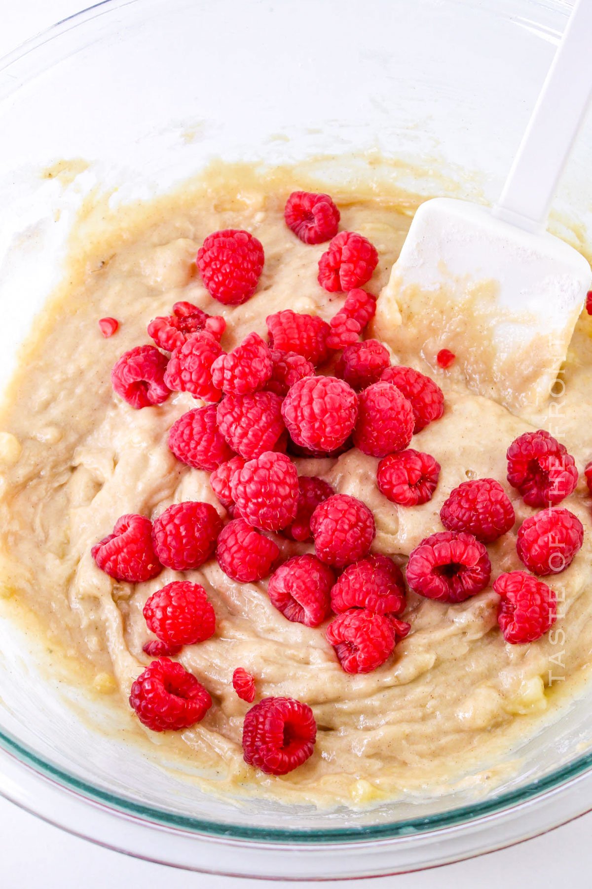 adding the fresh berries to the batter