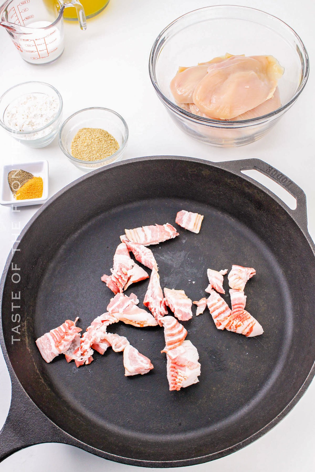 cooking the bacon pieces in the skillet
