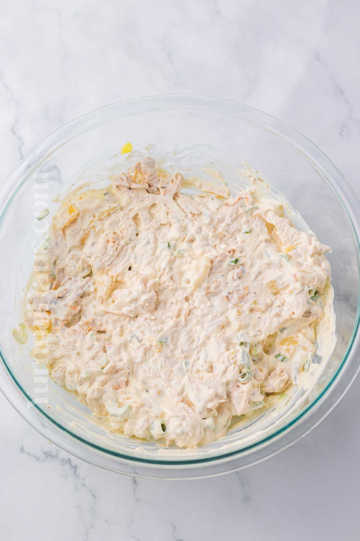 mixing the chicken