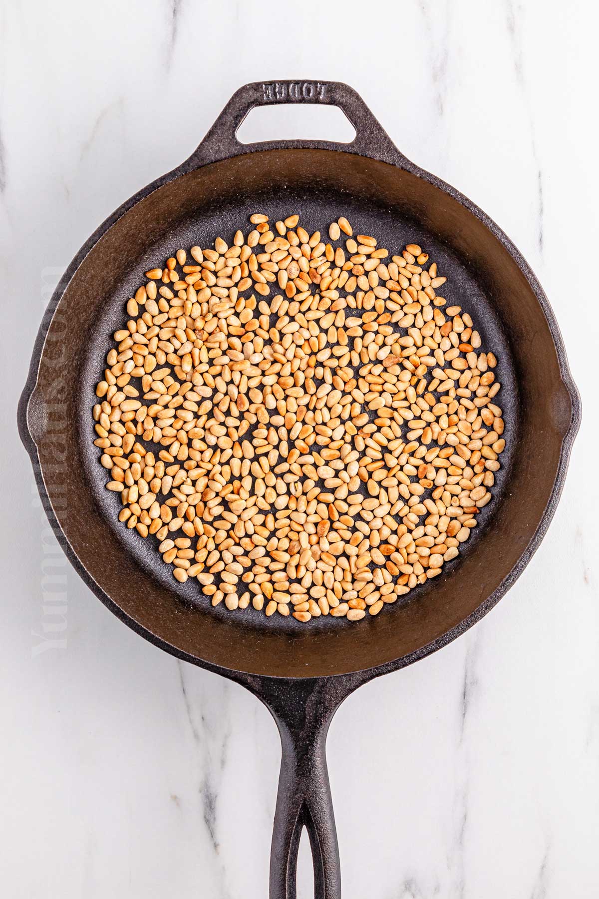 toasting the pine nuts