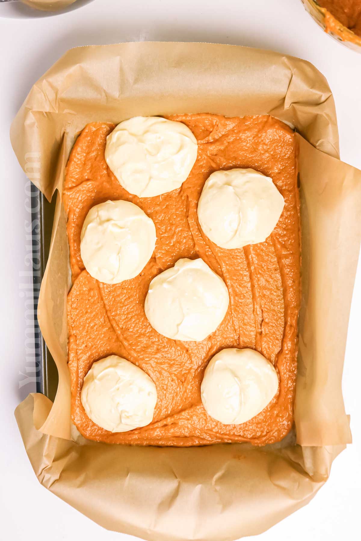 making the cake with cheesecake filling