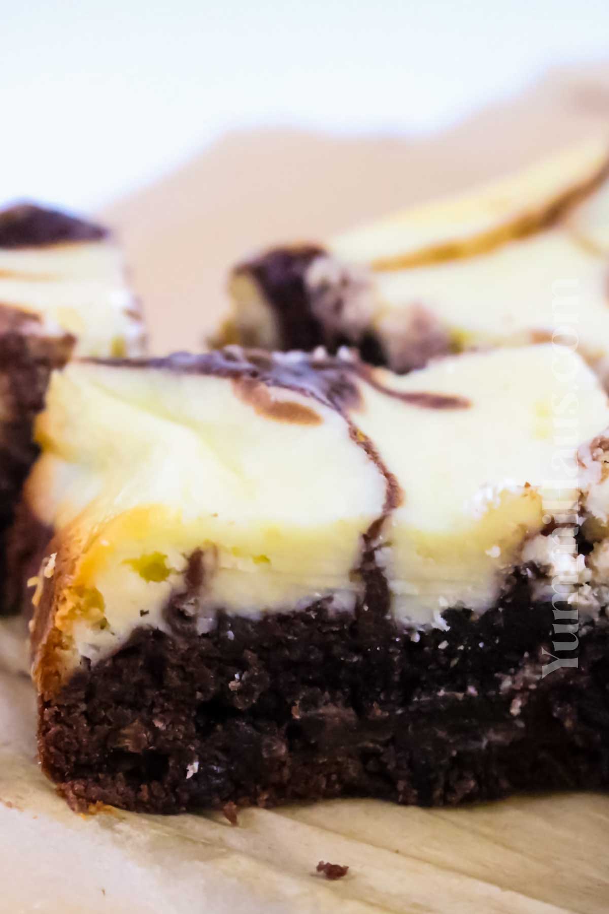 layers of brownie and cheesecake
